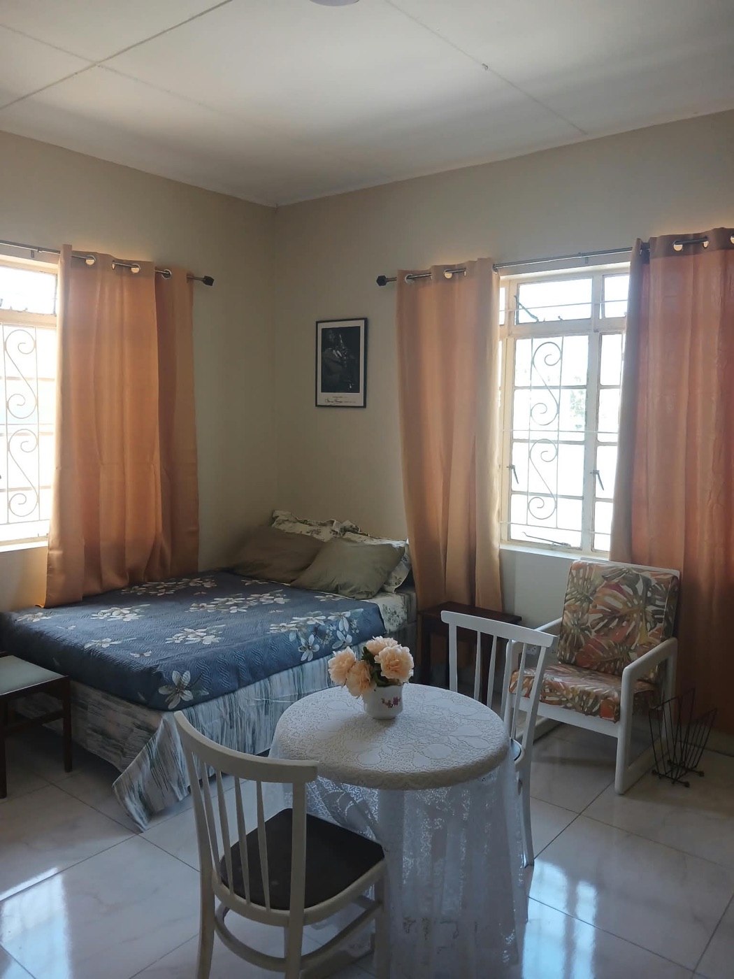 Sitting corner with armchair and side table by the windows