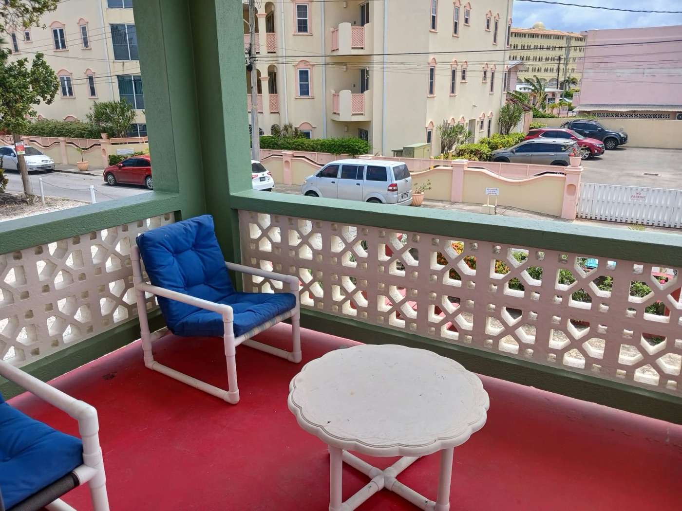 Apartment 3's breeze-block balcony looking down the avenue